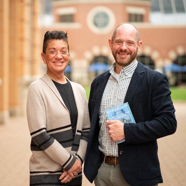 Professors John Lipford and Kristen Jack pose for a photo