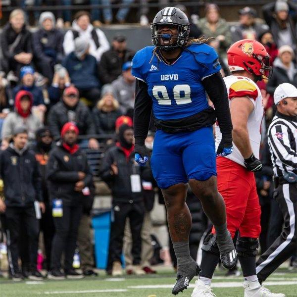 Grand Valley player jumps to celebrate making a good play.